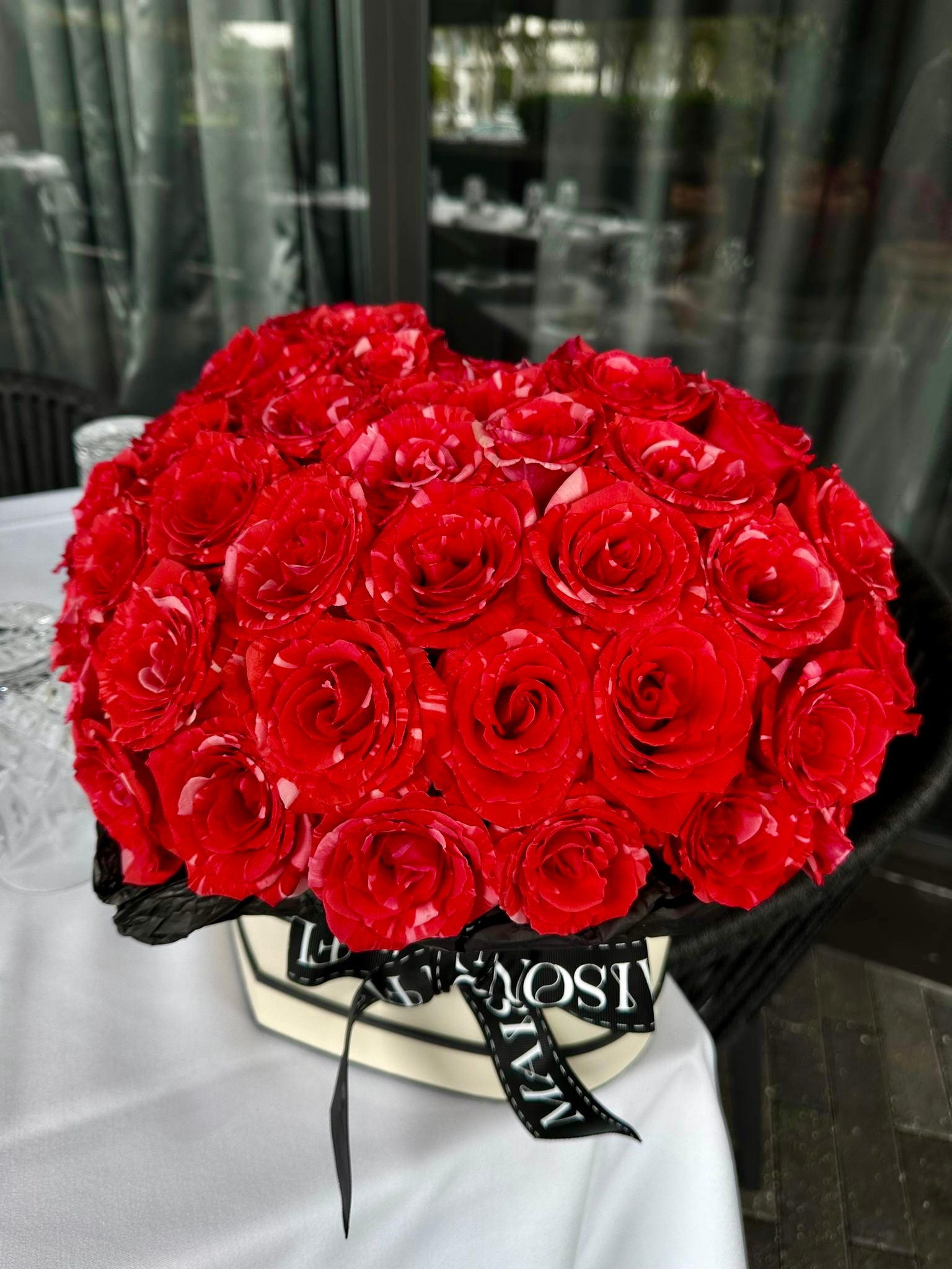 All of my heart - Heart Shaped box arrangement filled with Long stem premium roses(Red wildcat color)