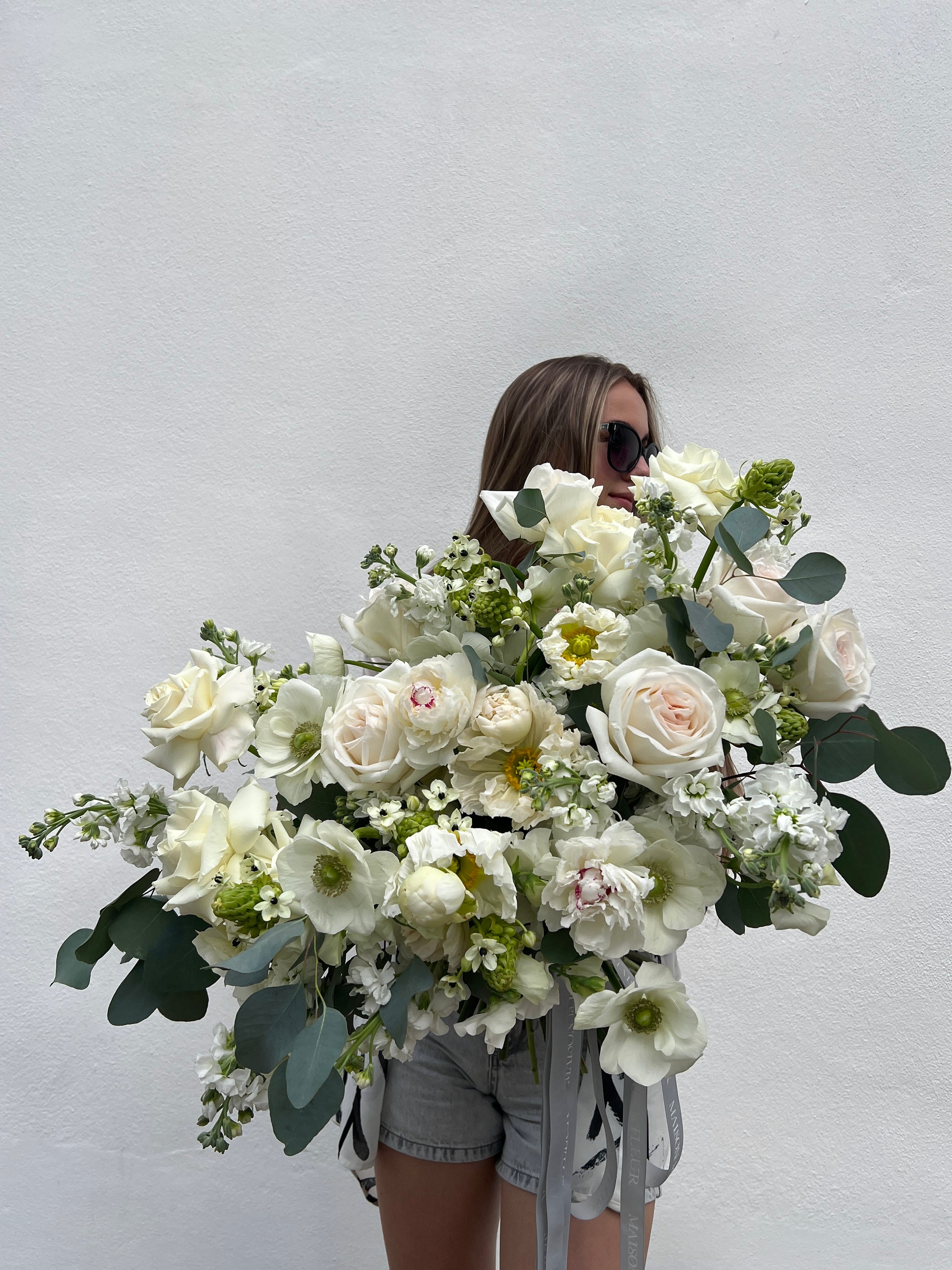 The Girl meets Green - Premium white O’Hara roses, peonies, stock flowers, anemones, puppies flowers, eucalyptus, and beautiful sweet pea flowers