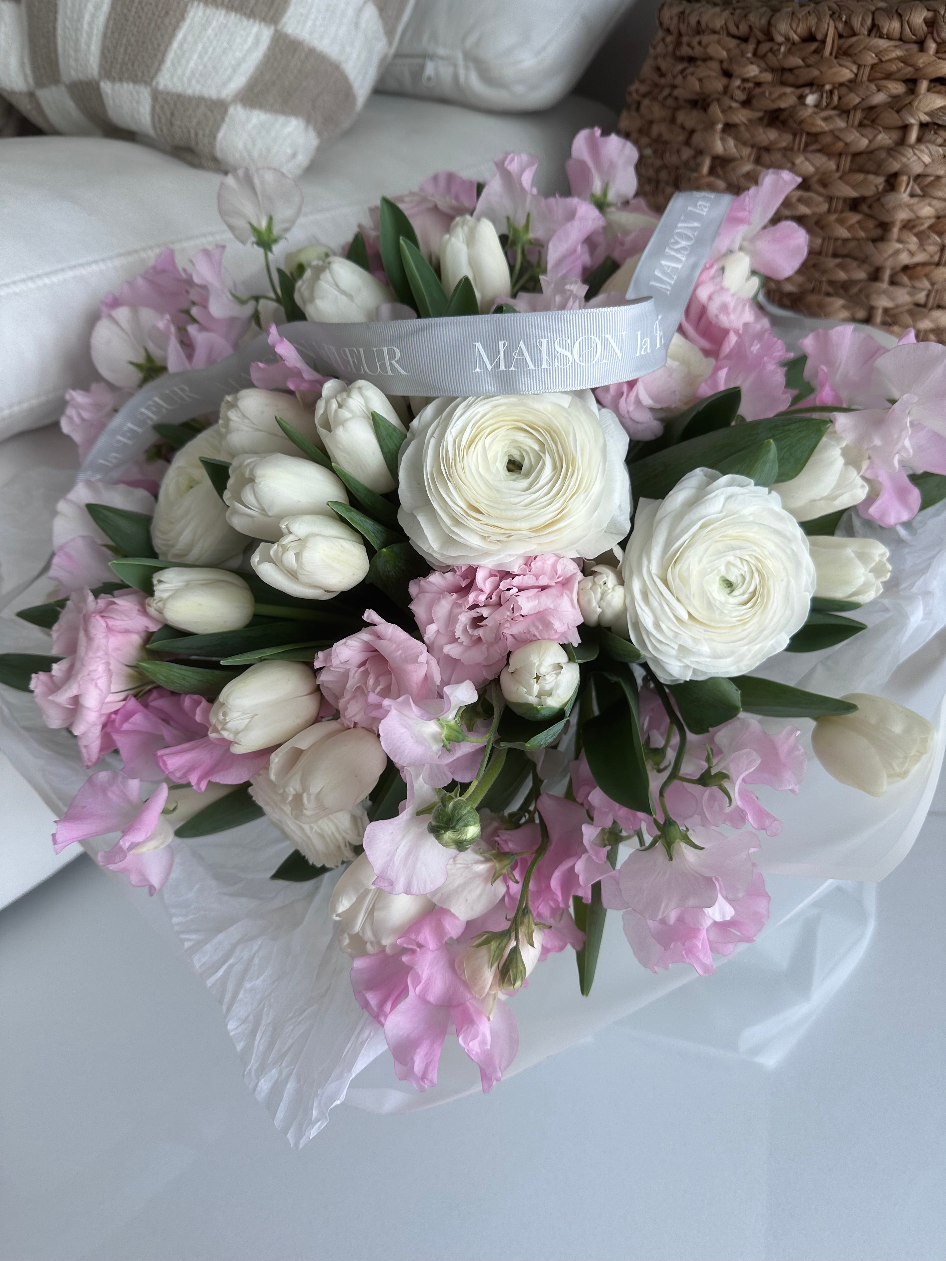 Pink charm - Beautiful bouquet of delicate spring tulips, ranunculus, lisianthus and sweet peas.