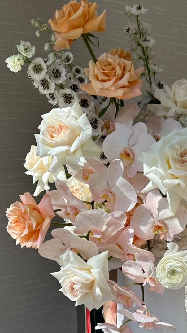 Malibu Sunset - David Austin fragrant garden roses, long stem roses, Dutch tulips , viburnum, Phaelonopsis, and hydrangea - Maison la Fleur