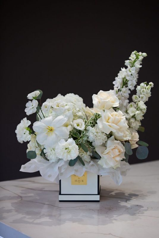 White Floral Arrangements, Spring Blossom - delicate arrangement of greens, roses